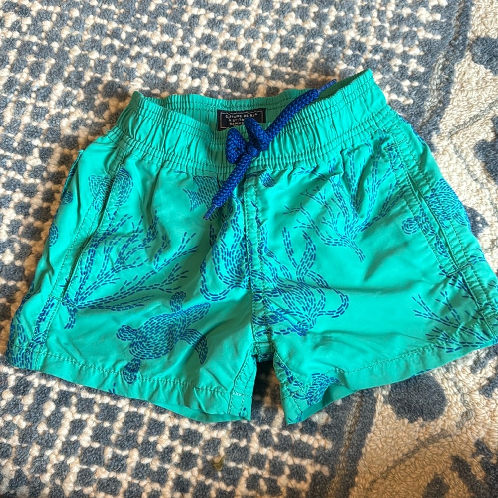 Vilberquin in green swim trunks